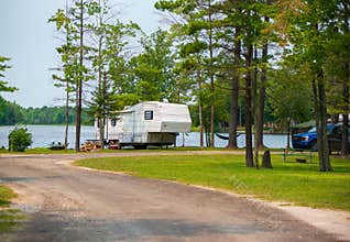 ALPENA MI - JULY 18TH: Road leading to a camper parked in an RV park on the waterfront