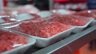 Raw fresh beef meat on the shelves of a hypermarket. Buying raw meat