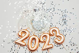 Holiday background Happy New Year 2023. Numbers of year 2023 made by gold candles