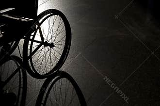 Closeup empty wheelchair on dark background