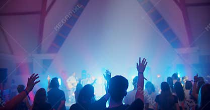 Christian Believers with Raised Hands Sing on Music Live Concert or Show Event