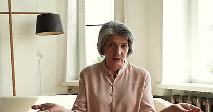 Webcam portrait elegant old female teacher broadcasting live video class