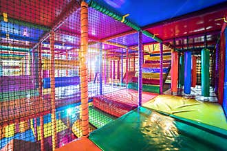 Kids running inside a Colorful indoor playground