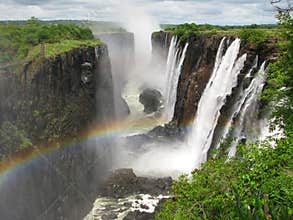 Rainbow over Victoria Falls on Zambezi River