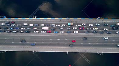 Aerial drone view of bridge road automobile traffic of many cars from above, city transportation