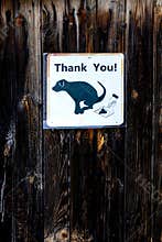 No dog poop sign on a wooden background
