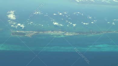 Flying over The Bahamas. Beautiful ocean colors. Actual aerial footage