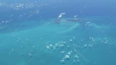 Flying over The Bahamas. Beautiful ocean colors. Actual aerial footage
