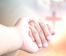 Christian Cross And Thorn Crown Symbol Behind Holding Hands Faith Concept