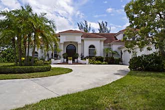 Luxury home with tile roof