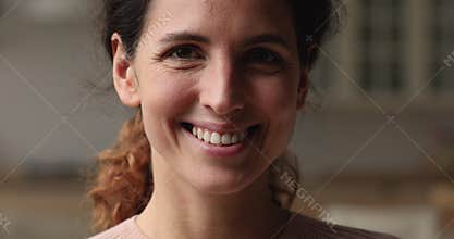 Sincerely smiling european young woman looking at camera.