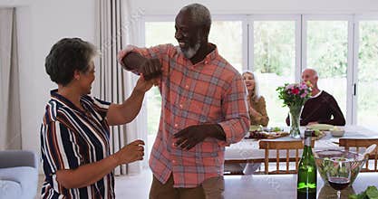 Senior african american couple dancing in a kitchen