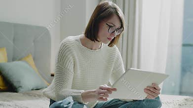 Lady in Glasses Work From Home on Tablet