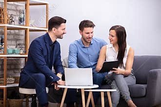 Advisor Sitting Near Happy Couple
