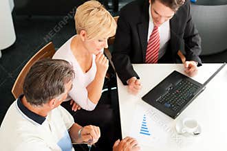 Mature couple with financial consultant