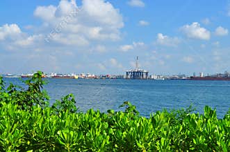 Greenery with industrial areas separated by water