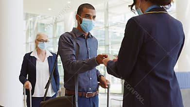 Passenger showing flight ticket on phone at airport during boarding
