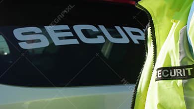 Security company car with a text of security written on the window