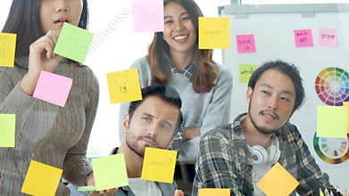 Creative design woman present talking use sticky notes post, present ideas. Diversity multi ethnic group brainstorming teams with