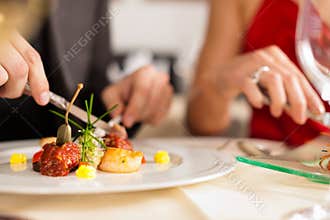 Couple eating dinner in very good restaurant
