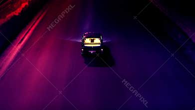 Visualisation of a video game with futuristic visual of driving a black car towards a modern city. Stock footage. Neon