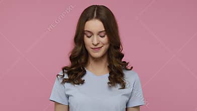 Girl winking and looking at camera, flirting expression.