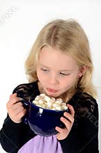 Little blonde girl with hot cocoa