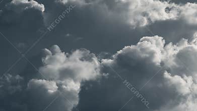 Dramatic rainclouds lit with bright sun, clouds in the sky