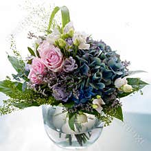Flower bouquet, pastel-colored summer flowers in arrangement. Roses, hydrangea blooming in summer flower bunch