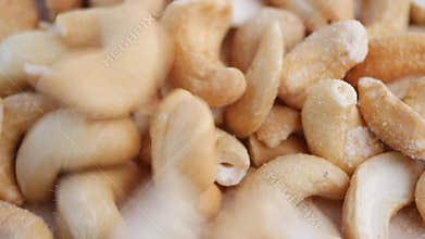 slow motion of cashew nuts dropping on table