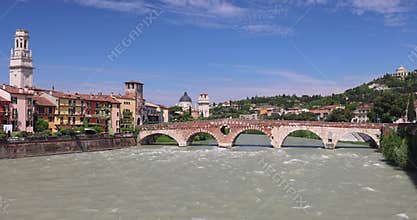 Ponte Pietra roman arch bridge crossing Adige River in Verona town, Italy, Europe