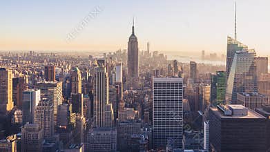 New York City skyline at sunset with Empire State Building.