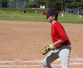 Youth baseball player fielding with clipping mask