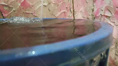 Rain falls into a basin