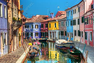 Colorful houses and canal on Burano island, near Venice, Italy.