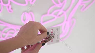 Close-up, hole punch discount cards with the number of visits to the beauty salon