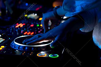 DJ mixing and scratching music at a concert