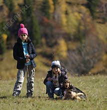 Girls hiking with dog