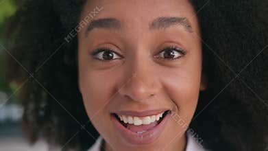 Close up excited shocked face African American woman girl female looking at camera wow surprised businesswoman amaze