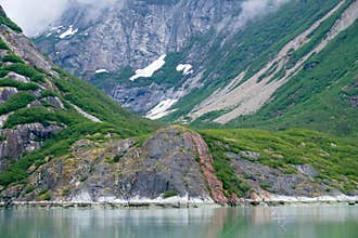 Valley in Endicott Arm with lowering fog and clear tide line