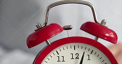 Red alarm clock ringing in morning closeup 4k movie slow motion