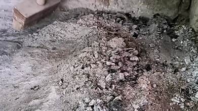 removing burnt ashes from the furnace