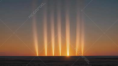 As the sun dips below the horizon solar pillars rise up as if to bid it goodnight