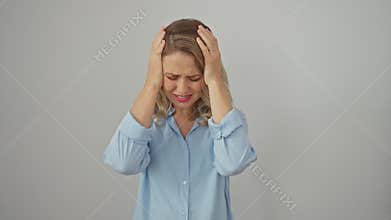 Depressed young blonde woman in shirt, aching from severe headache standing isolated on white background. stressed with pain,