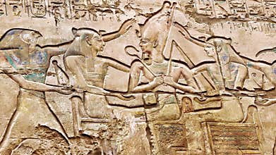 A wall relief carving of an Egyptian god at Luxor Temple