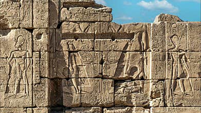 Ancient Egyptian murals and writings on the stone walls of the Karnak Temple