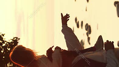 Family walks in the countryside during sunset. Love, parental care and children concept. Vertical.