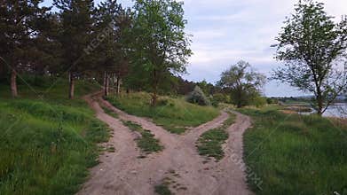 Split country road scene. Crossroad concept choosing the way