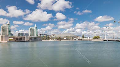 Panorama showing Parque das Nacoes or Park of Nations district timelapse in Lisbon, Portugal.