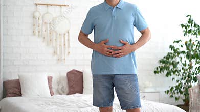 Stomach ulcer, man with abdominal pain suffering at home, symptoms of gastritis, diseases of the digestive system